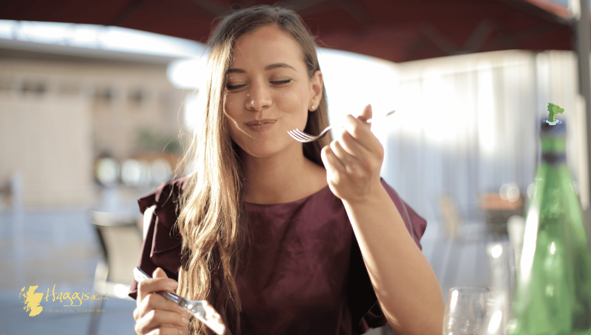 Woman eating haggis