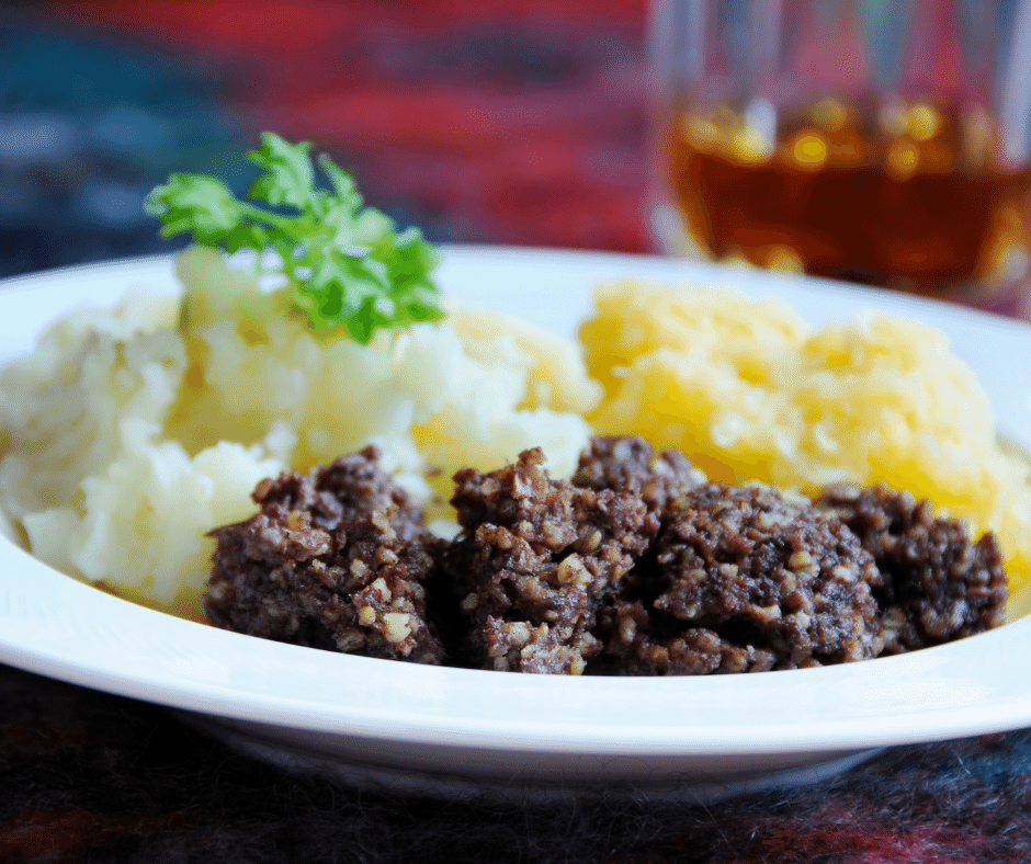 Haggis, neeps and tatties in a bowl with a parsley garnish